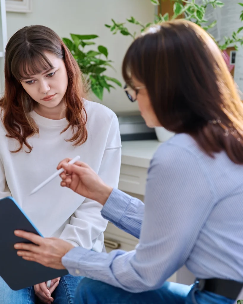doctor offering health resources to a patient